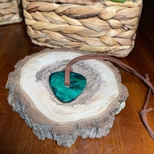 Variegated Green Resin Pendant Necklace, on Brown Suede Cord.